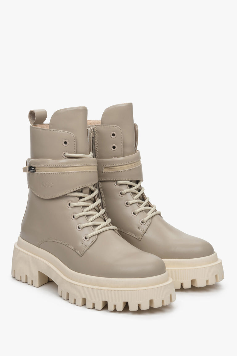 Estro brand women's winter boots made of genuine leather in beige color - close-up on the front and side of the shoe.