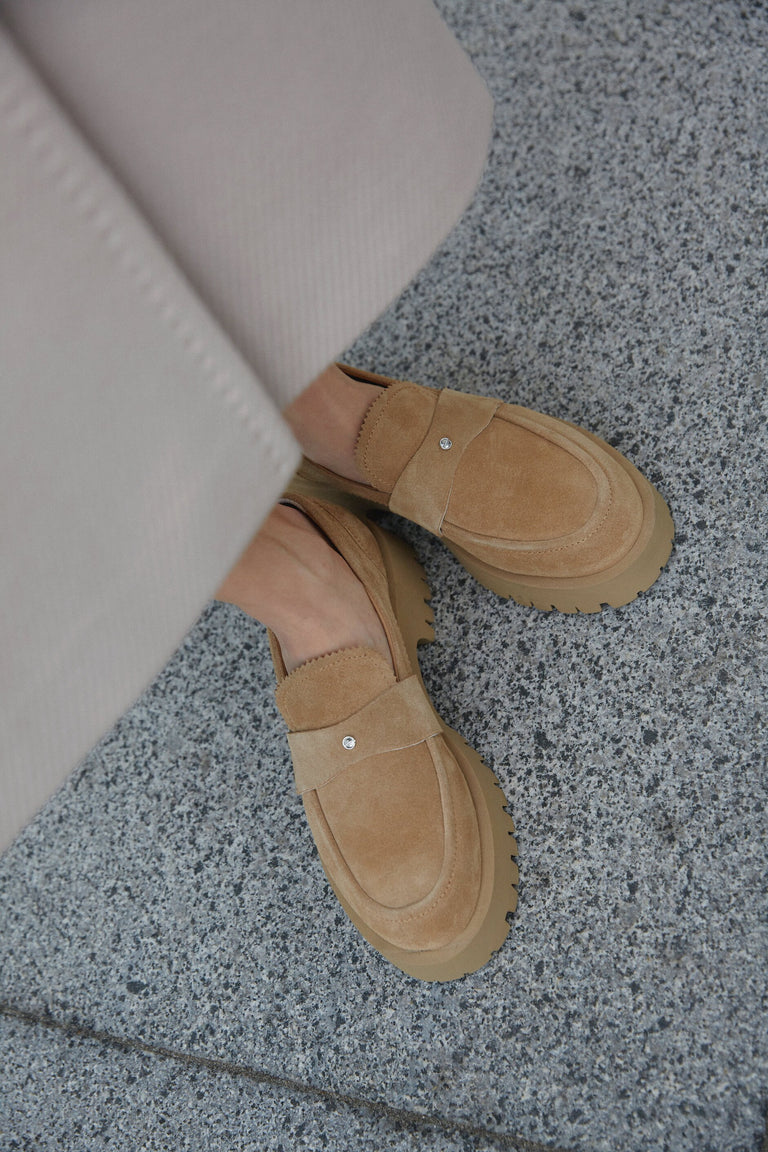 Women's brown loafers made of genuine velour with a chunky sole by Estro - presentation on a model.