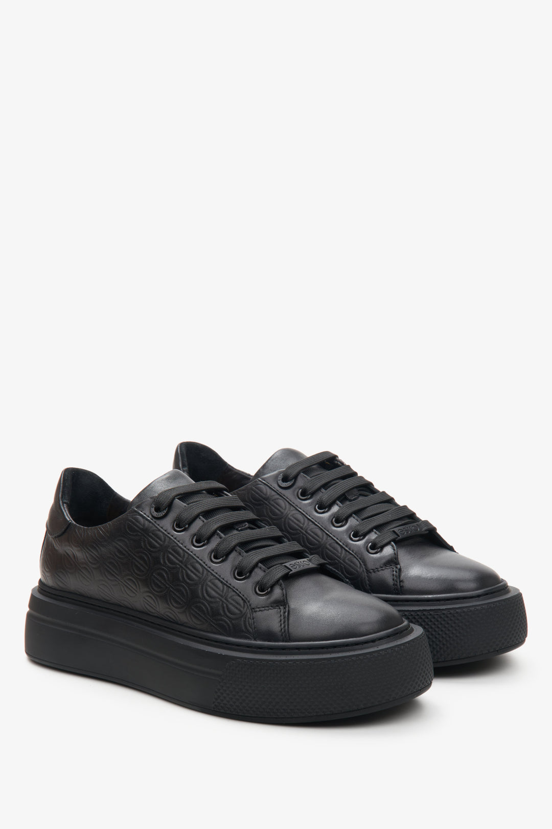 Women's black sneakers made of genuine leather with thick sole.