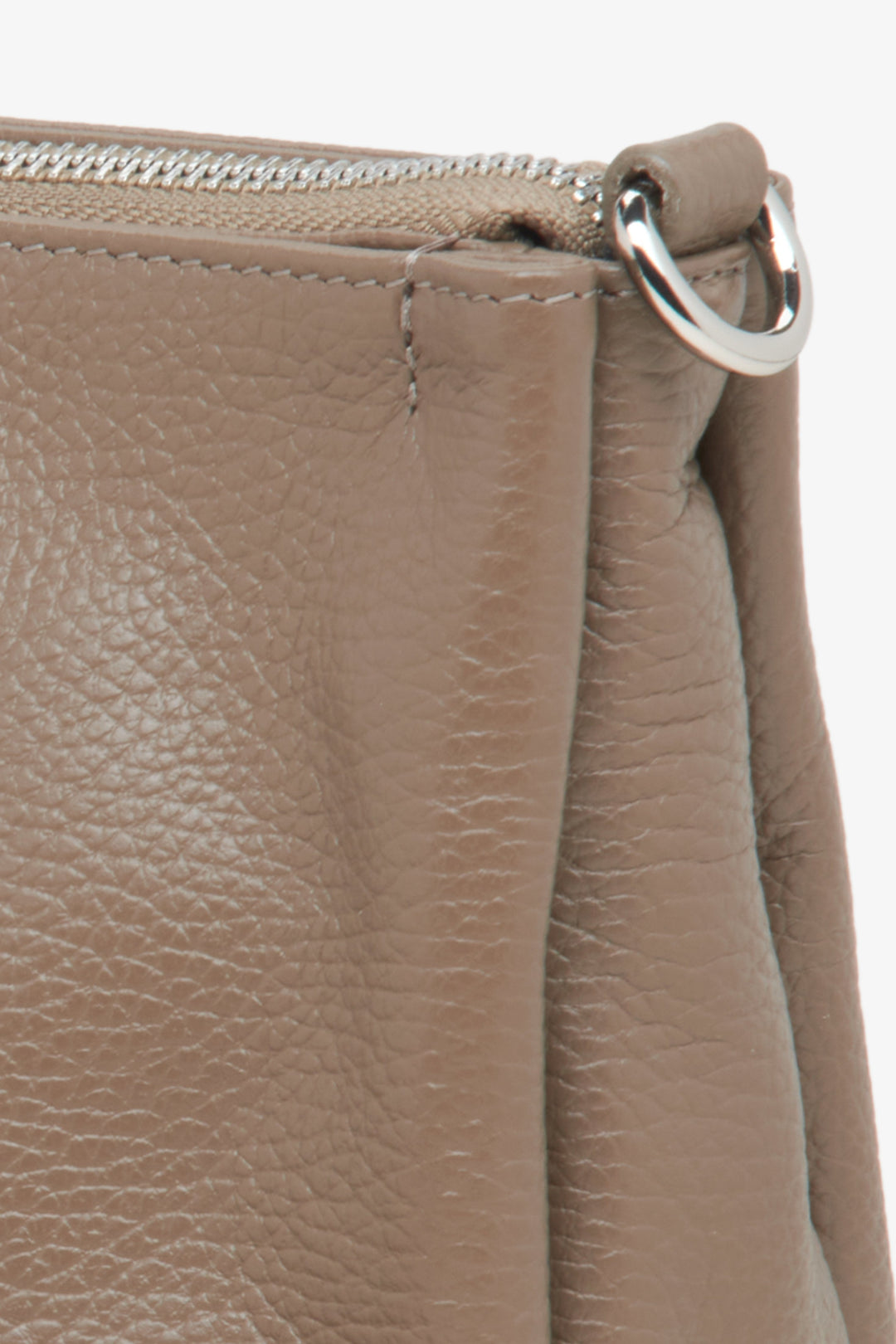 Women's dark beige Estro crossbody bag made from genuine leather - close-up on details.