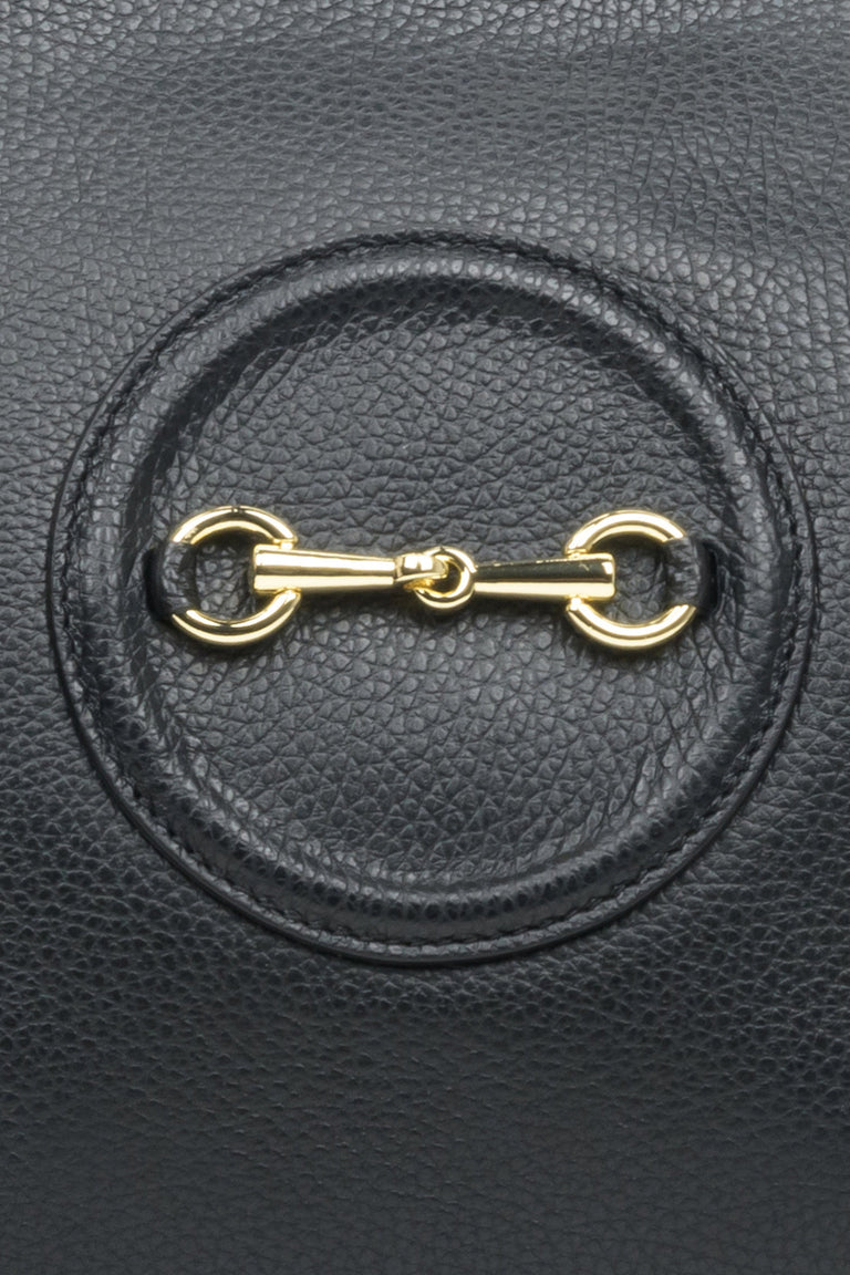 Spacious, black leather women's handbag by Estro with gold accents - close-up on the details.