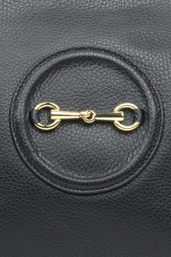 Spacious, black leather women's handbag by Estro with gold accents - close-up on the details.