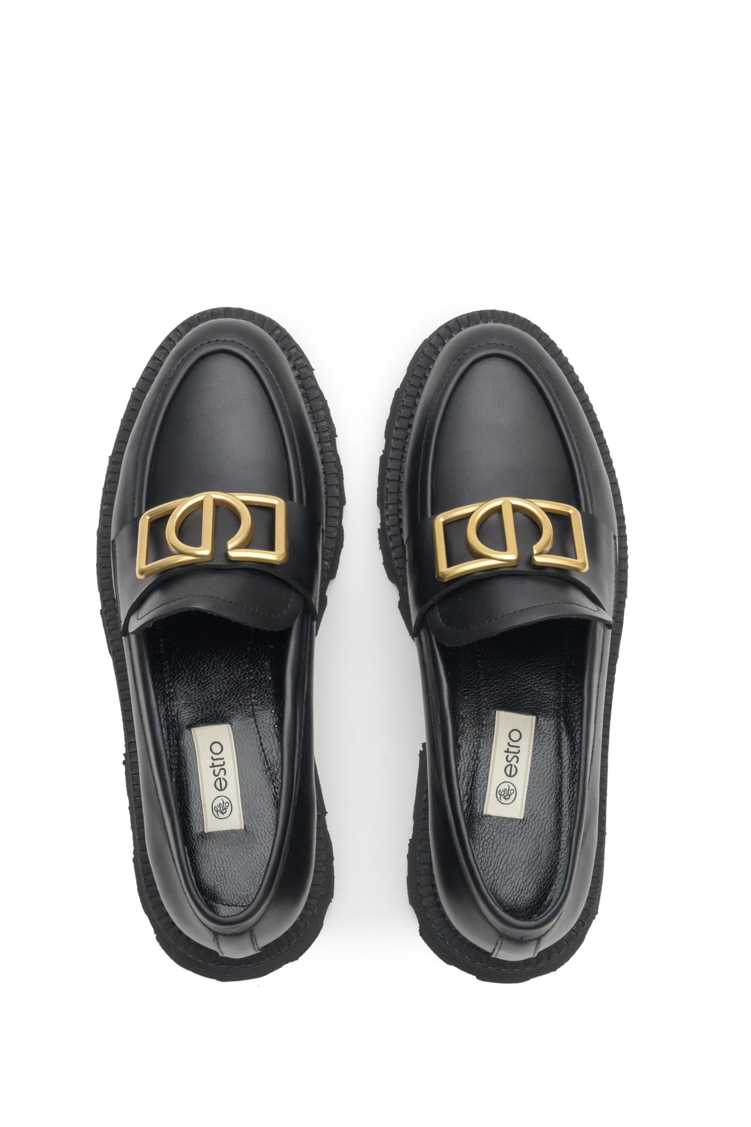 Black women's loafers made of natural leather with gold chain - presentation of the footwear from above.