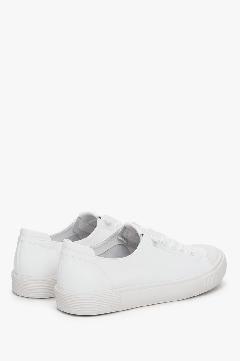 Women's lace-up white sneakers by Estro - close-up on the side seam and heel.