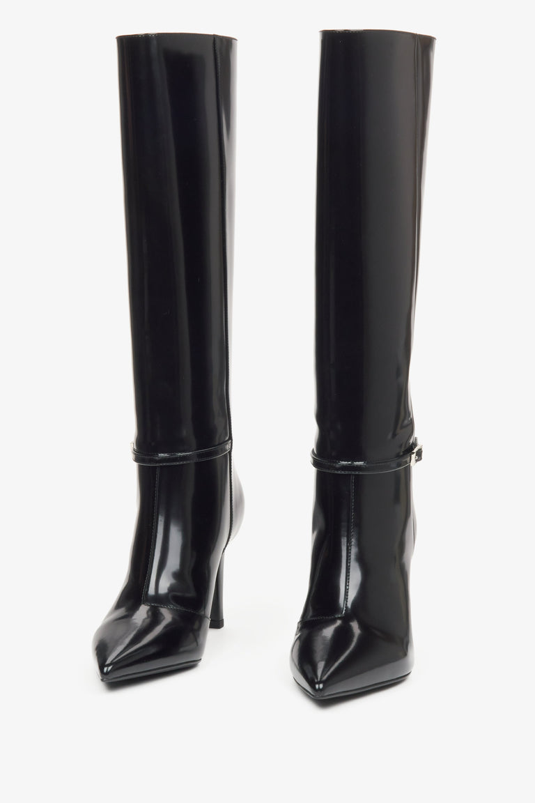 Black patent leather knee-high boots with a high heel from Estro - front view of the footwear.