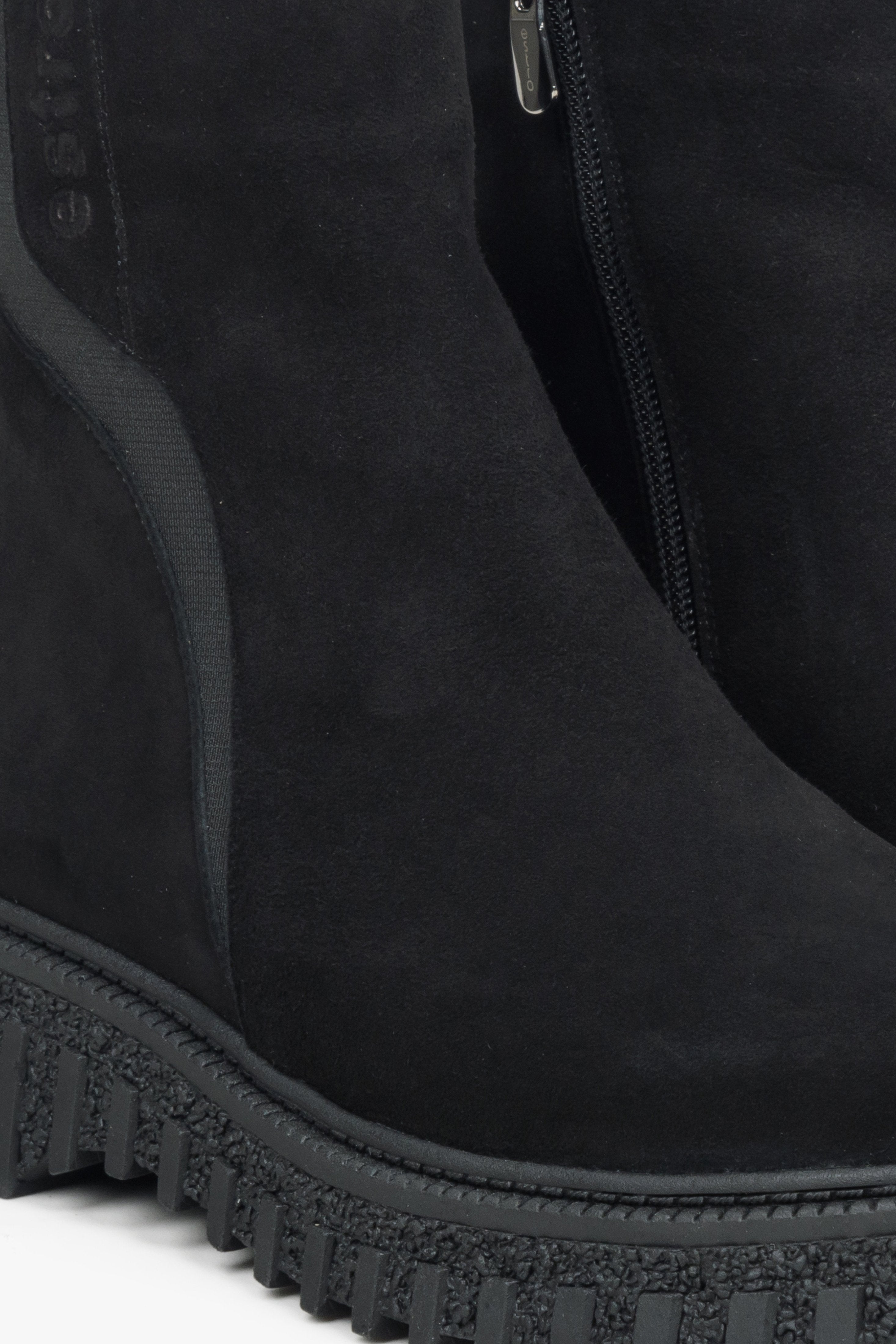 Women's black velour ankle boots - a close-up on details.