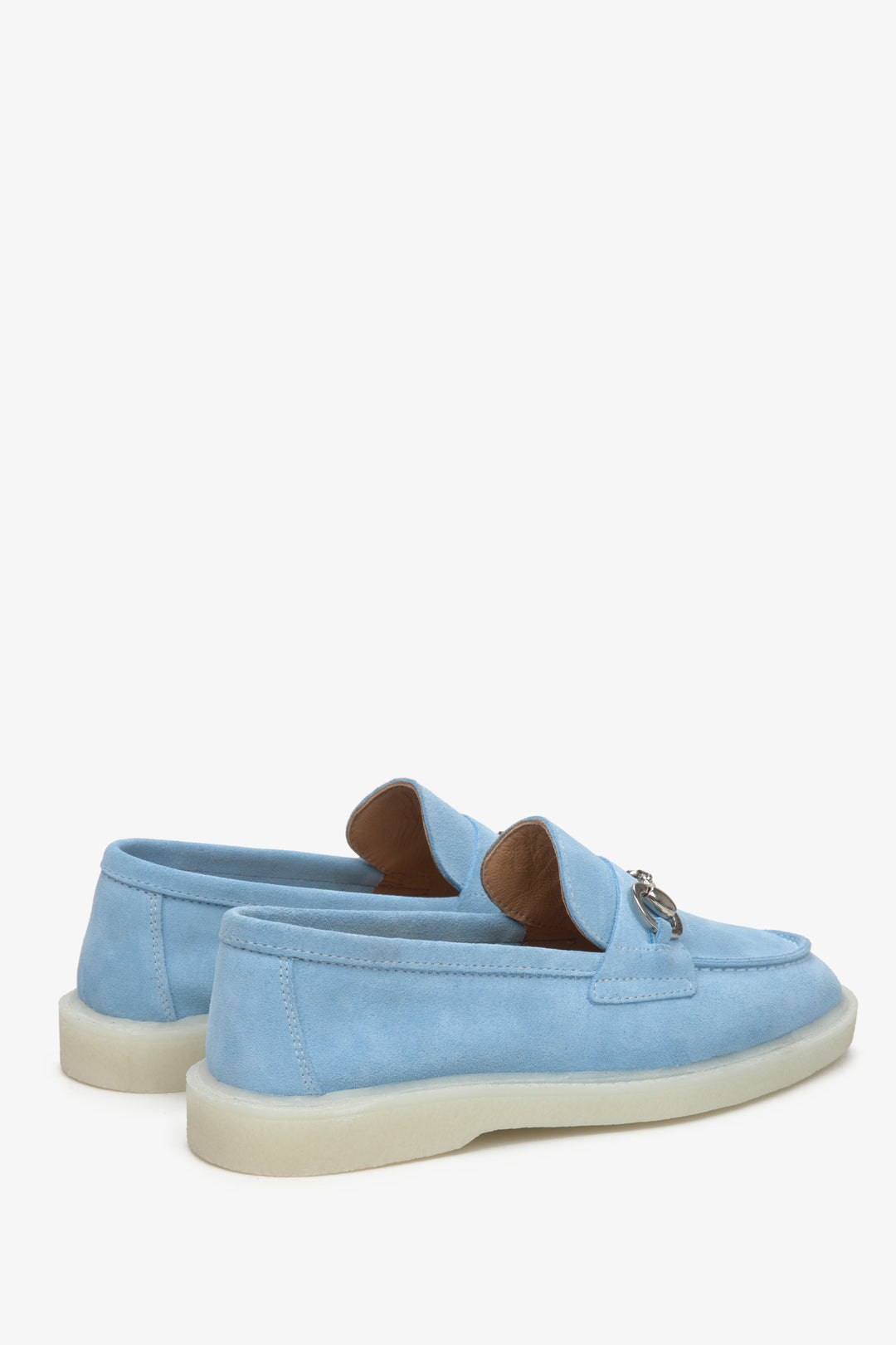Women's light blue loafers made of velour and leather with gold buckle by Estro - close up on heel counter.