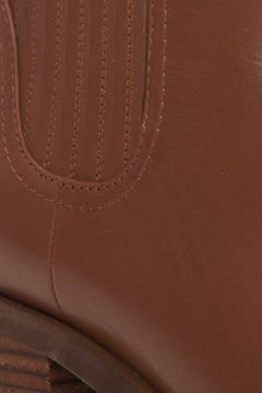 Women's brown chelsea boots - close-up on details.