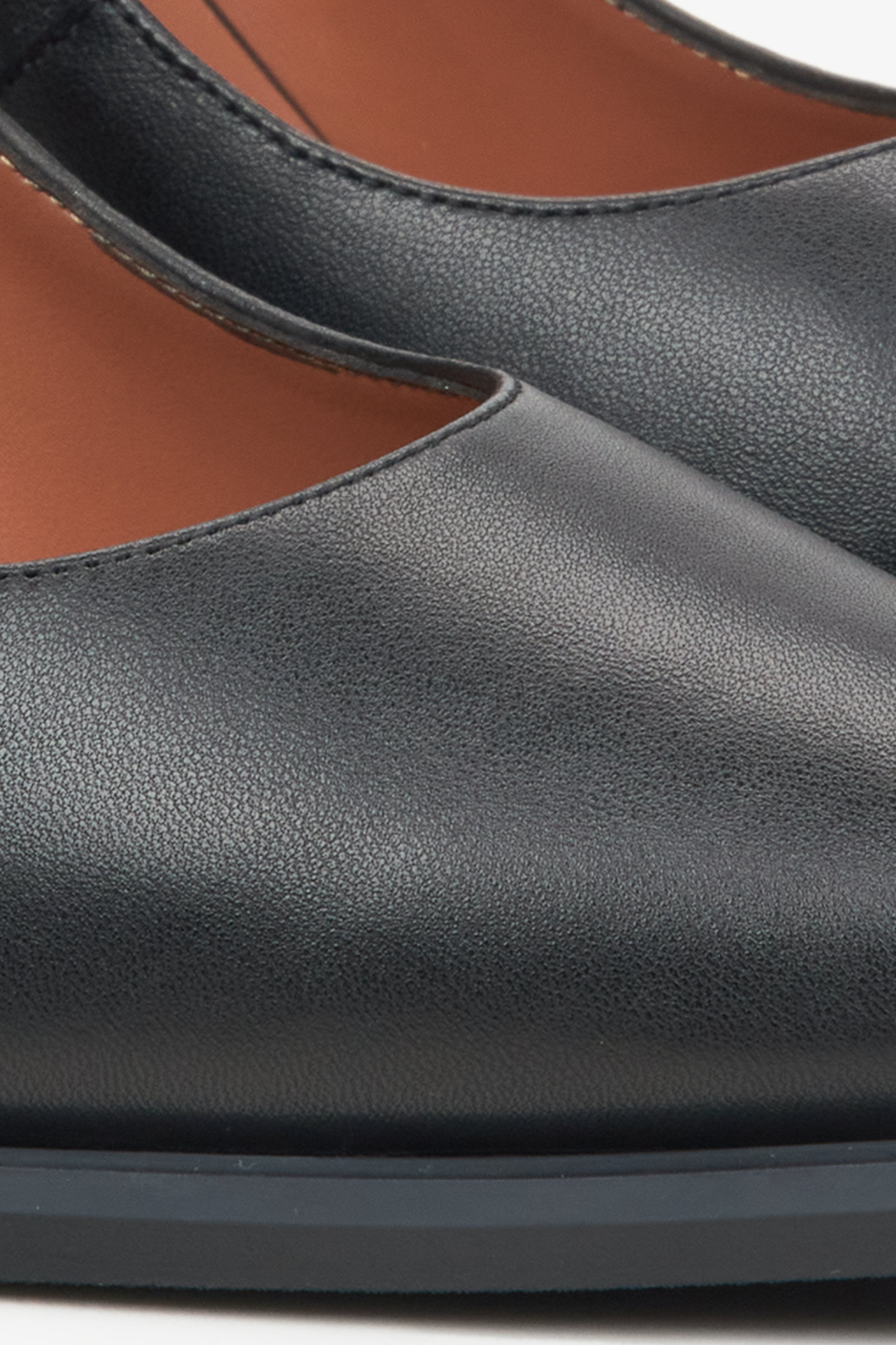 Women's black leather pumps by Estro - close-up on detail.