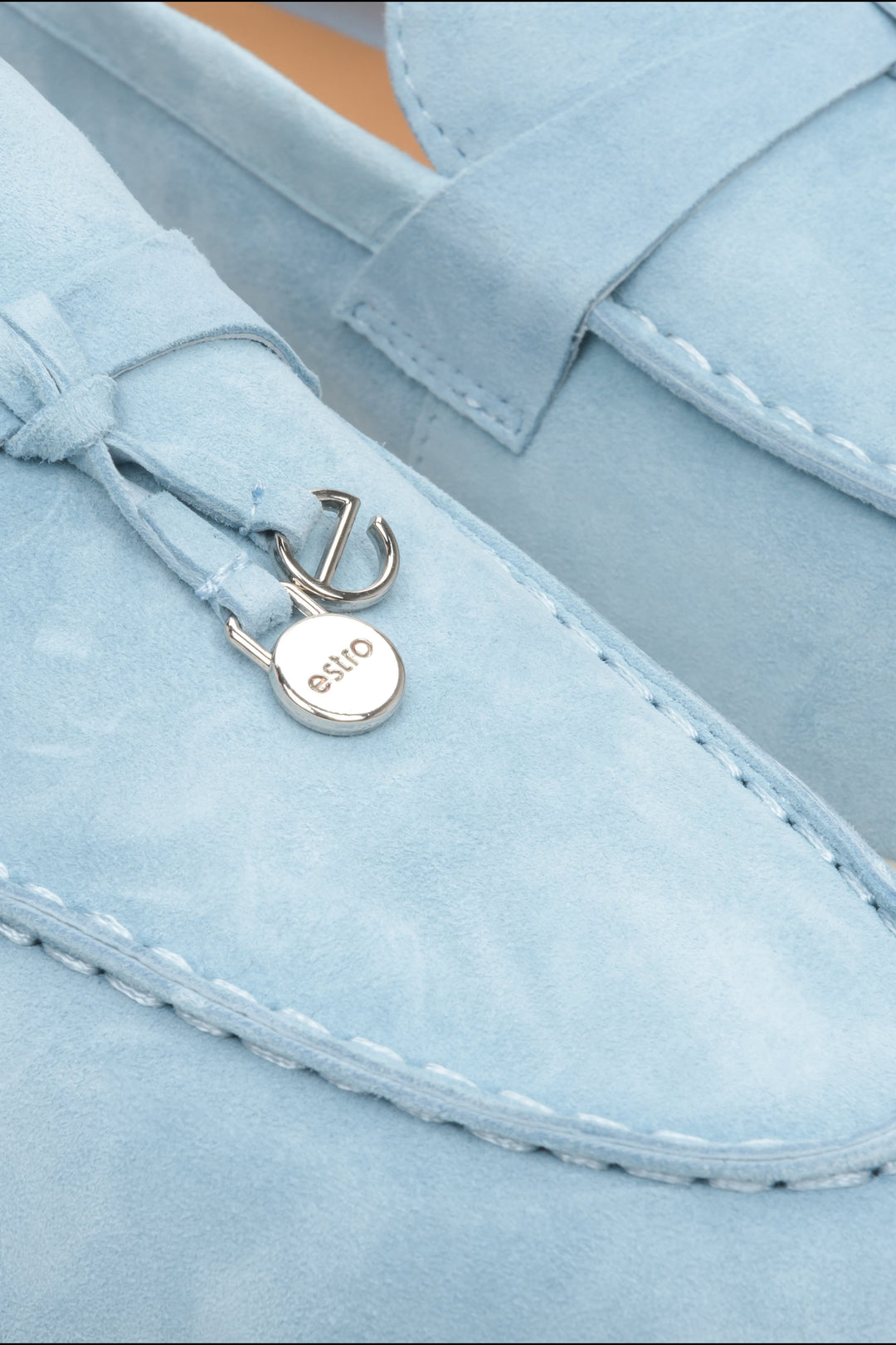 Light blue comfy and elegant women's velour loafers - close-up on details.