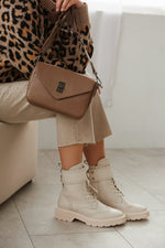 Women's light beige ankle boots - fully-stylized footwear.