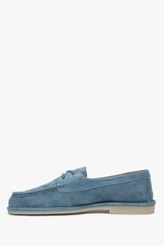 Stylish blue Estro women's loafers, made of soft velour and laced in a distinctive nautical style.