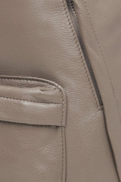Big women's grey and brown backpack made of genuine leather by Estro - close-up of the details.