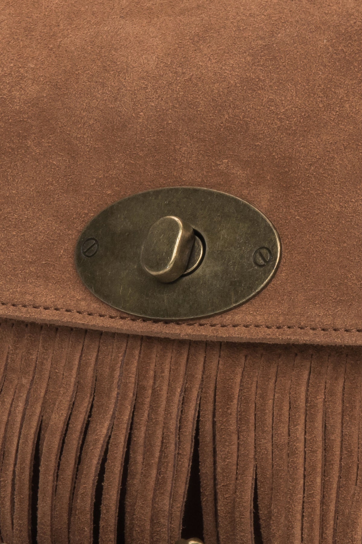 The bag styled with the adjustable strap, demonstrating versatile wear as a shoulder or crossbody option.