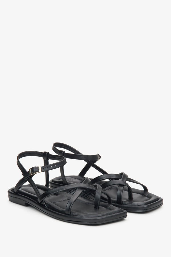 Women's black sandals made of genuine leather with criss-cross straps by Estro.