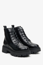 Women's black Estro low leather boots with laces - close-up on the toe box and lacing system.