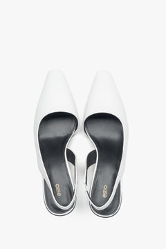 Women's white pumps by Estro, made of genuine leather, with a low heel and slingback strap.
