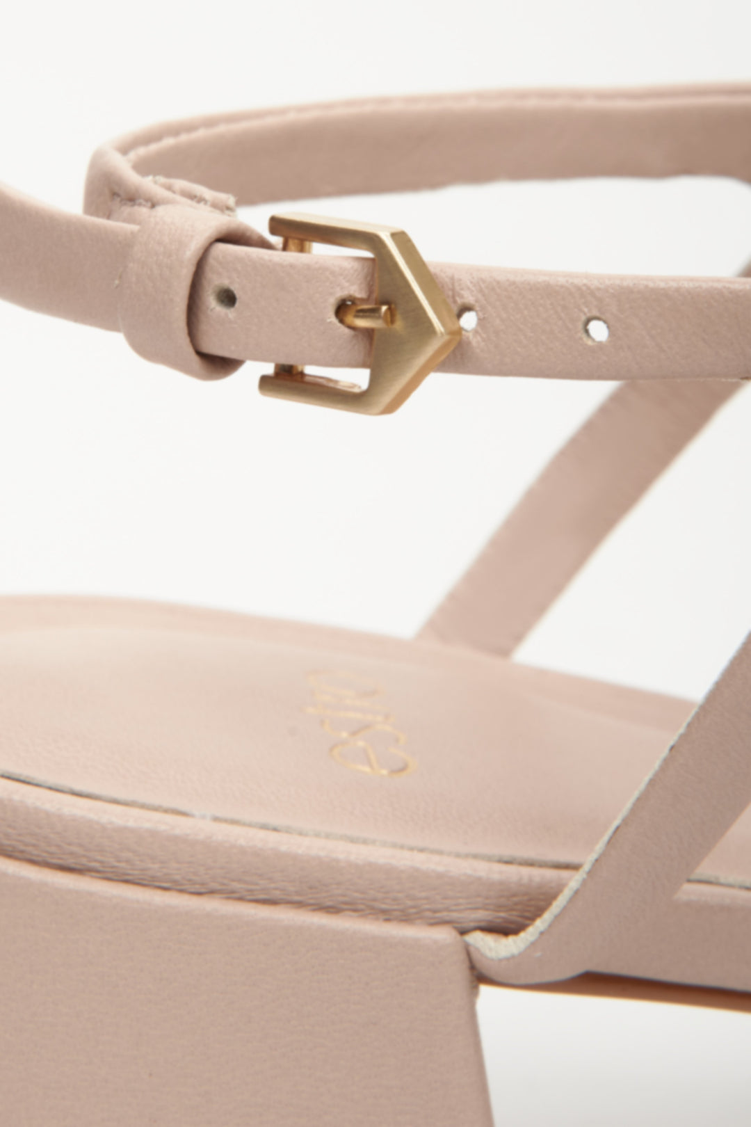 Women's beige sandals made of genuine leather by Estro - close-up on details.