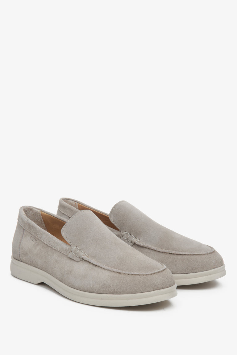 Elegant light grey velour loafers for her - presentation of a shoe toe and sideline.