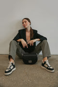 Women's sneakers in black and beige by ES8 - presentation on a model.