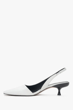 White leather women's slingback pumps by Estro with an open heel and low heel – side profile of the shoe.