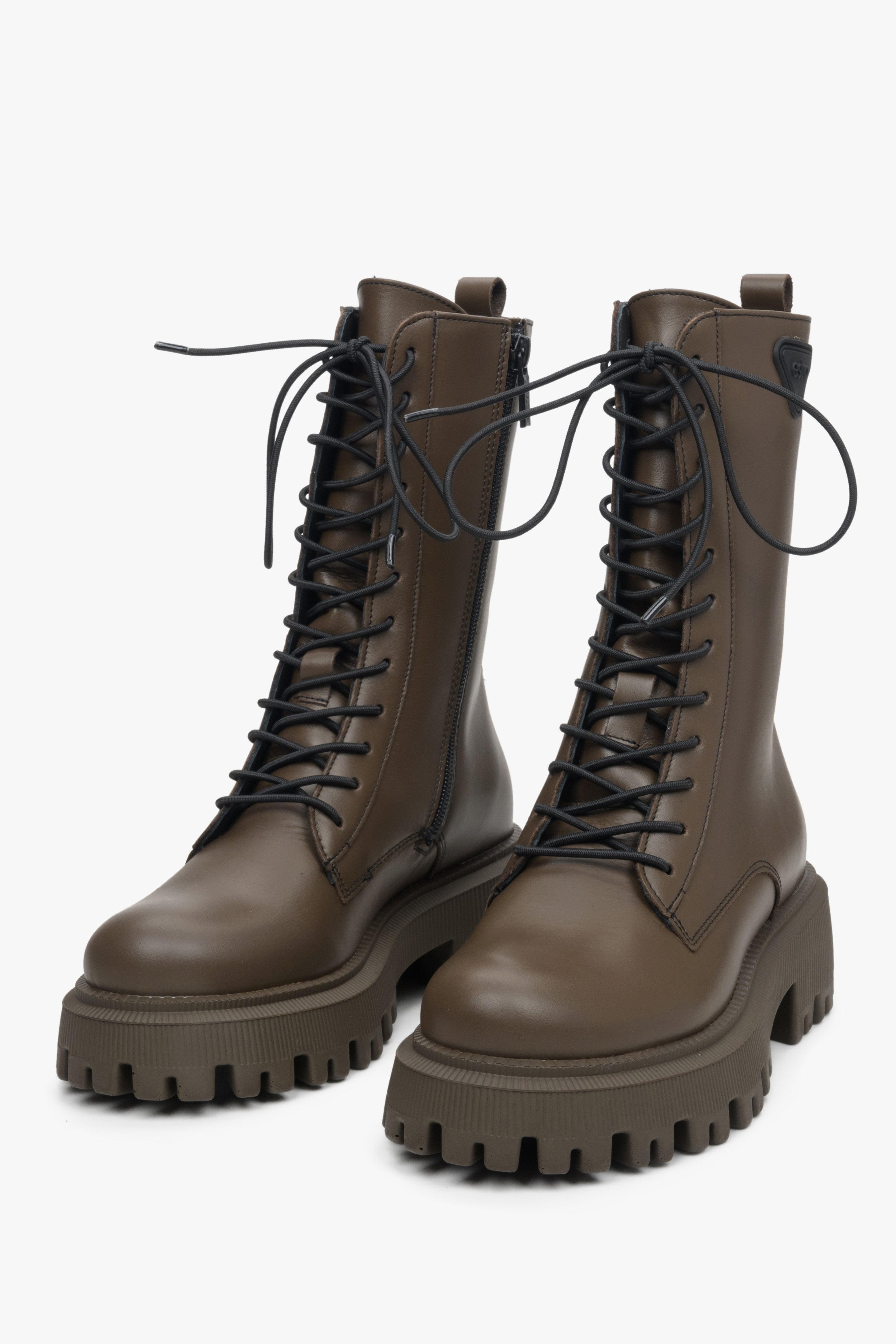 Women's high dark brown leather combat boots by Estro - close-up of the shoe's toe and decorative lacing system.