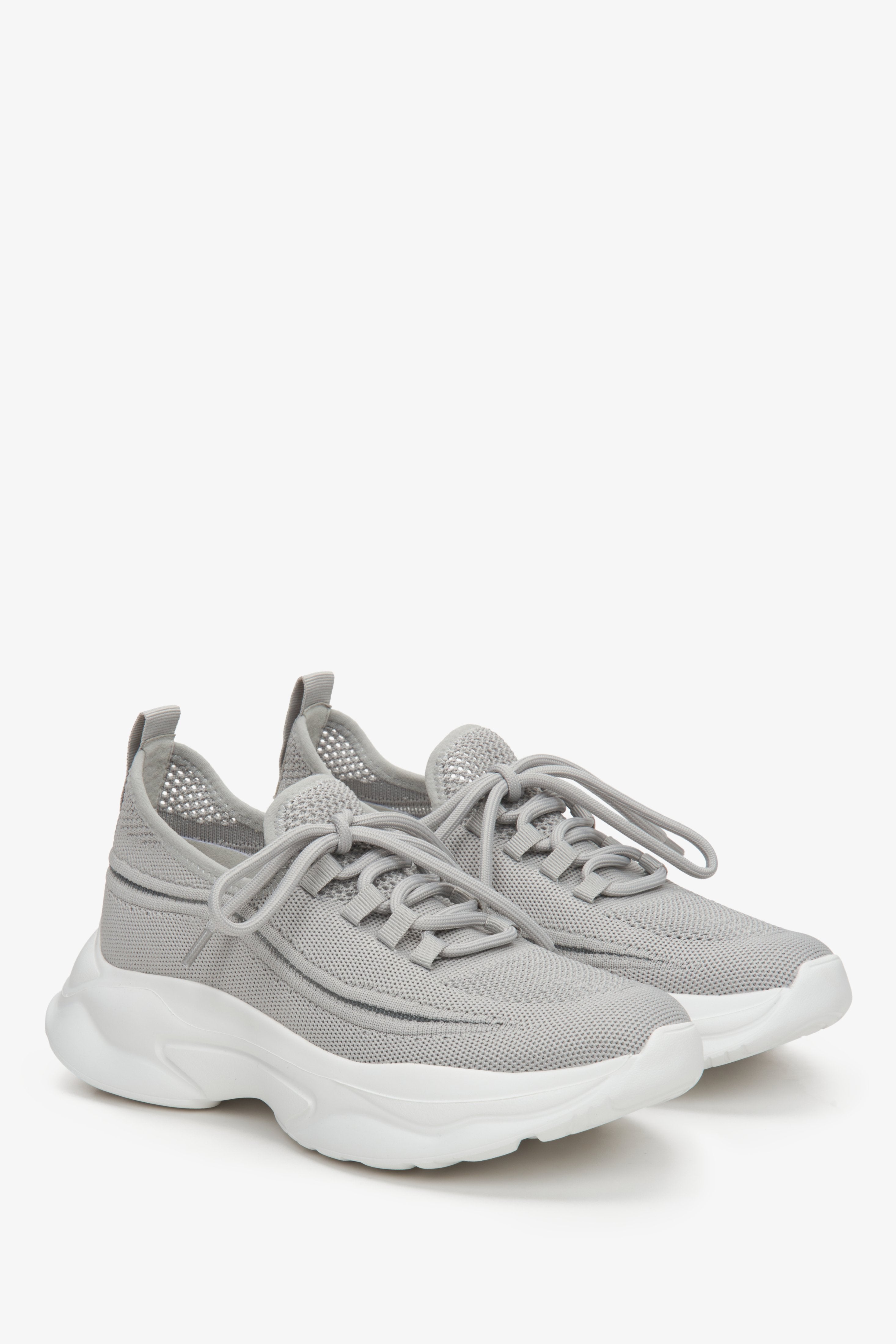 Low-top mesh and textile women's sneakers in grey.