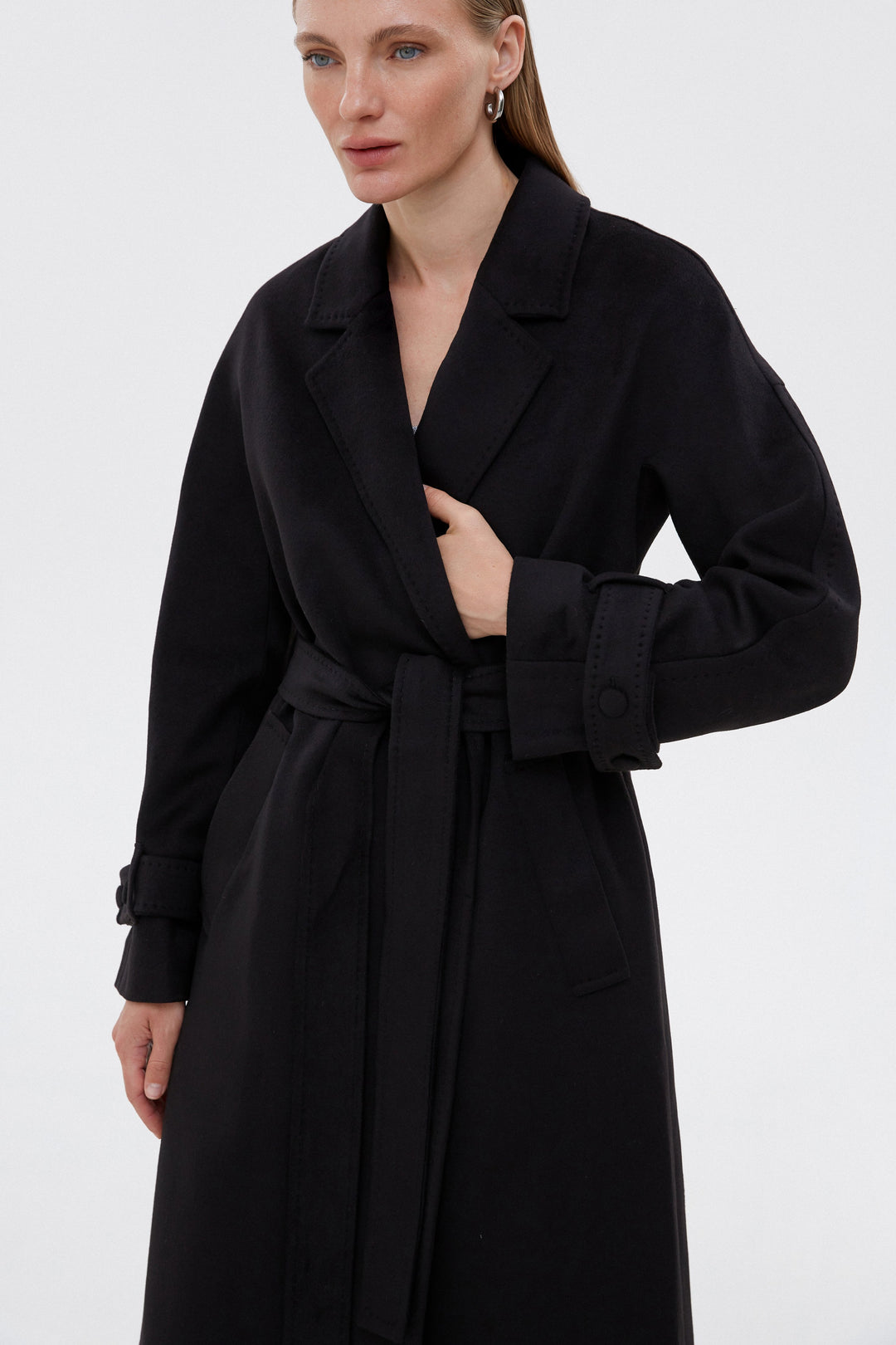 Women's long classic coat in black by Estro.