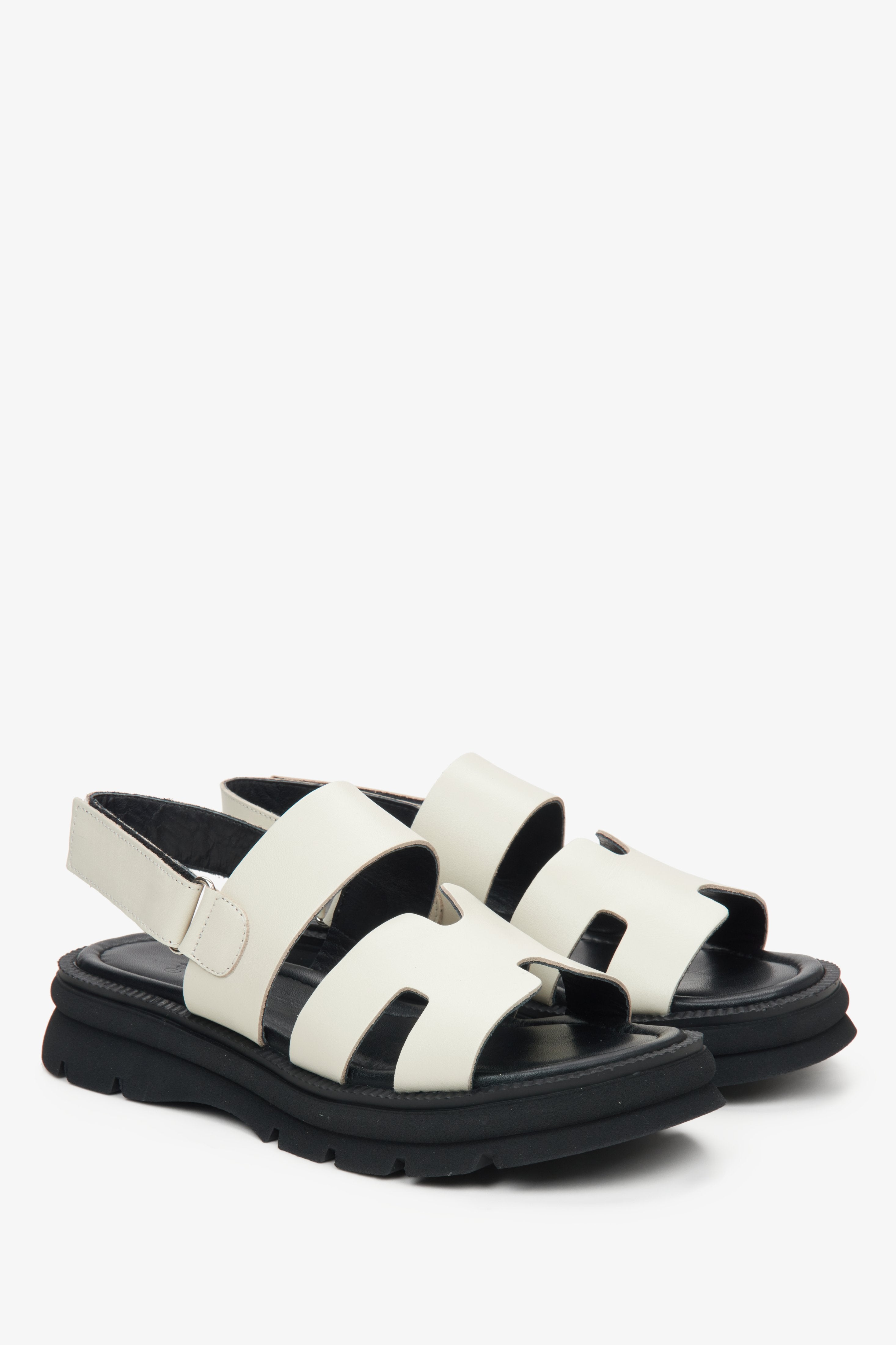 Women's white leather sandals with a flexible sole by Estro.