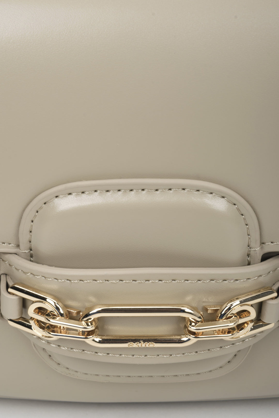 Women's grey and beige leather bag - close-up on the detail.