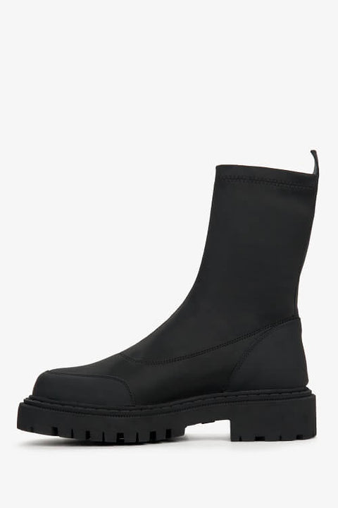 Black women's slip-on ankle boots with a flexible upper - shoe profile.