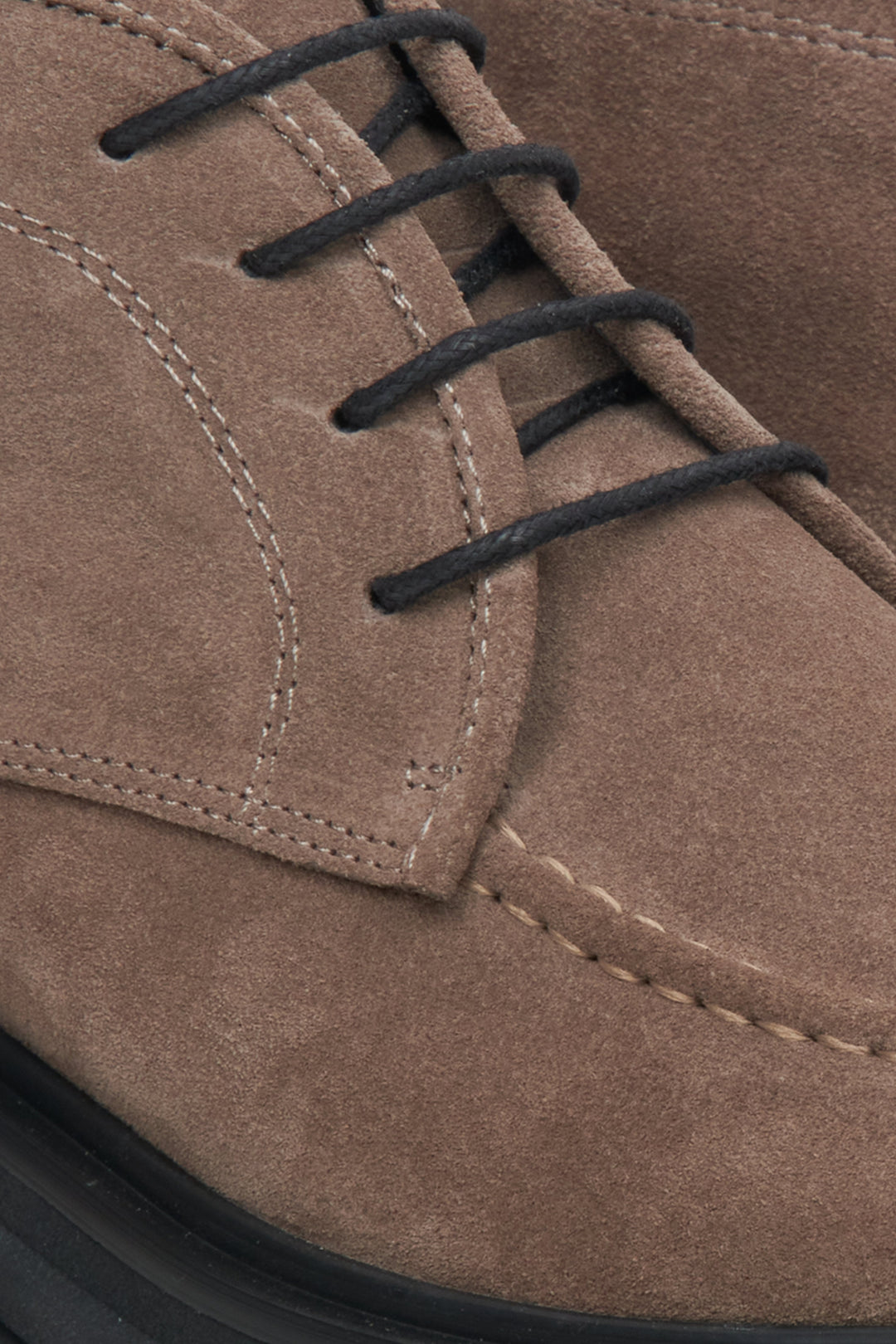 Women's lace-up brown suede boots by Estro - close-up on the detail.