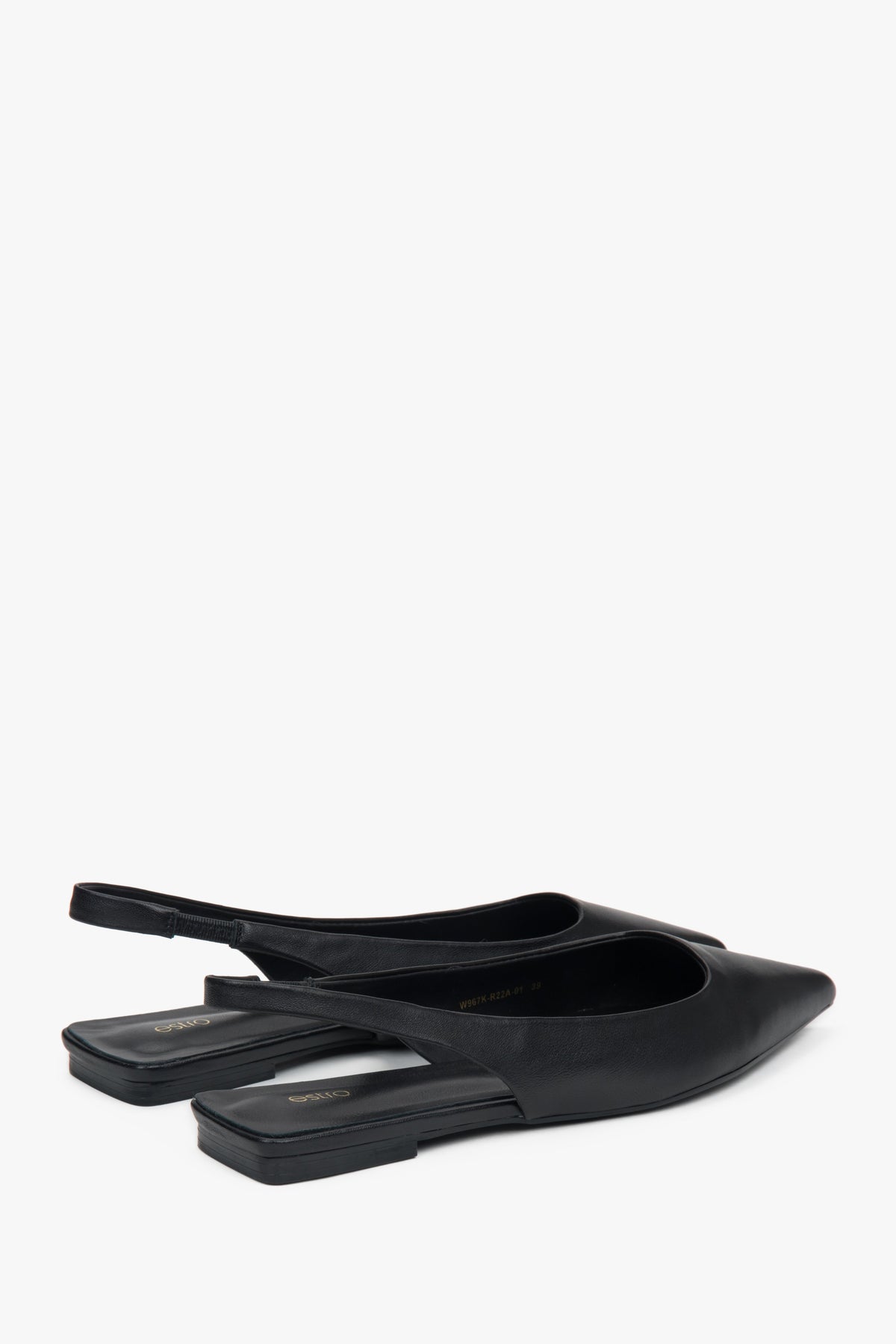 Black slingback sandals with a pointed toe and flat heel.
