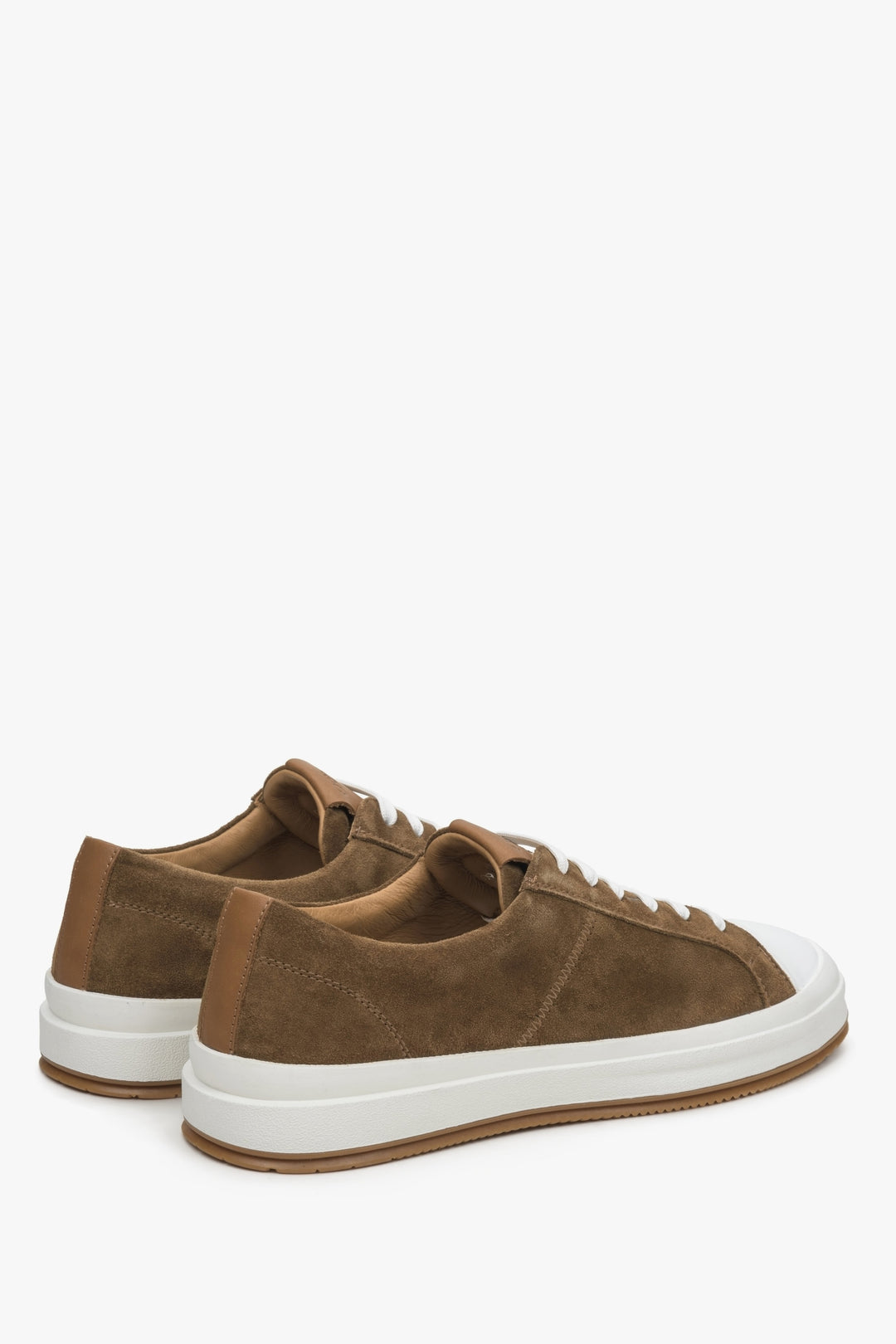 Men's brown sneakers made of genuine velour - close-up on the heel and side line of the shoes.