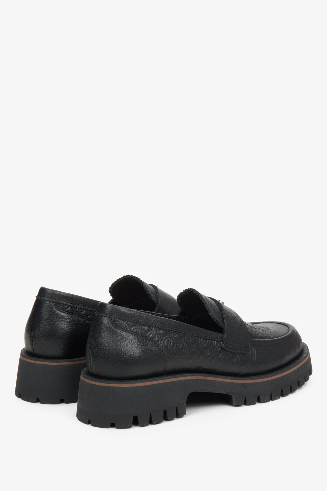 Women's black leather loafers by Estro - close-up on the heel and side line of the shoe.