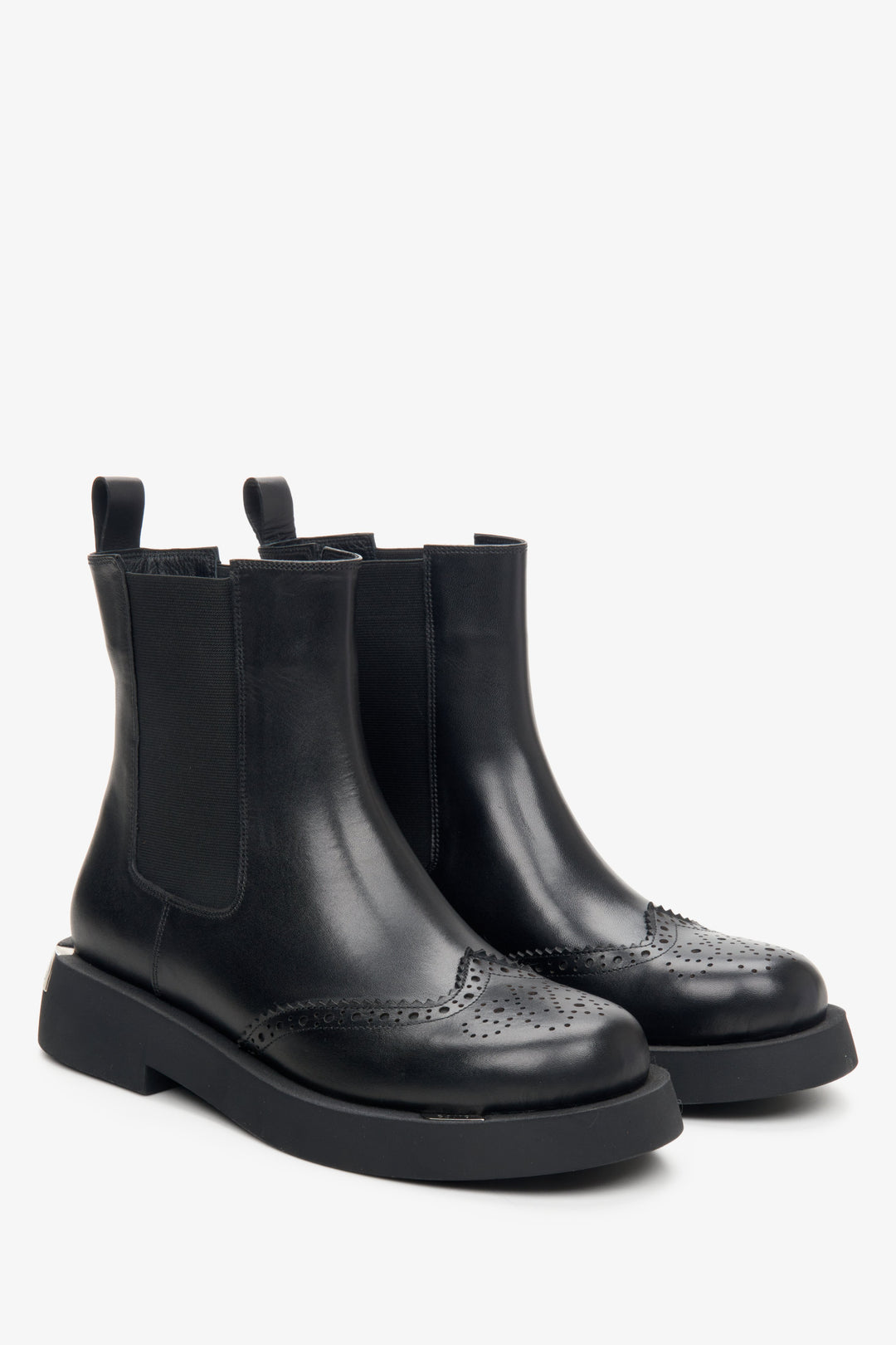 Women's black chelsea boots made of genuine leather with perforation by Estro.