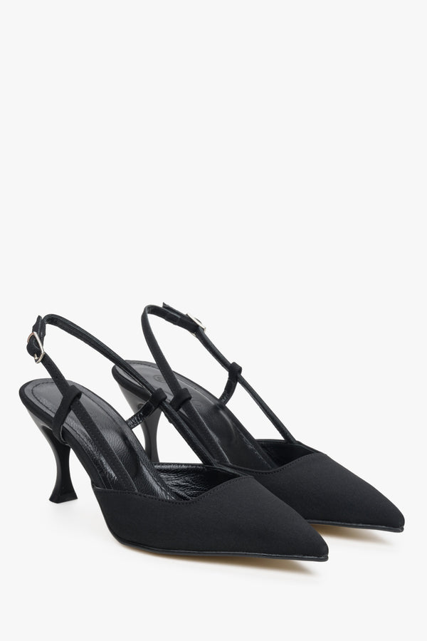 Women's black slingback shoes on a funnel heel.