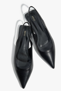 Black slingback sandals with a pointed toe and flat heel.