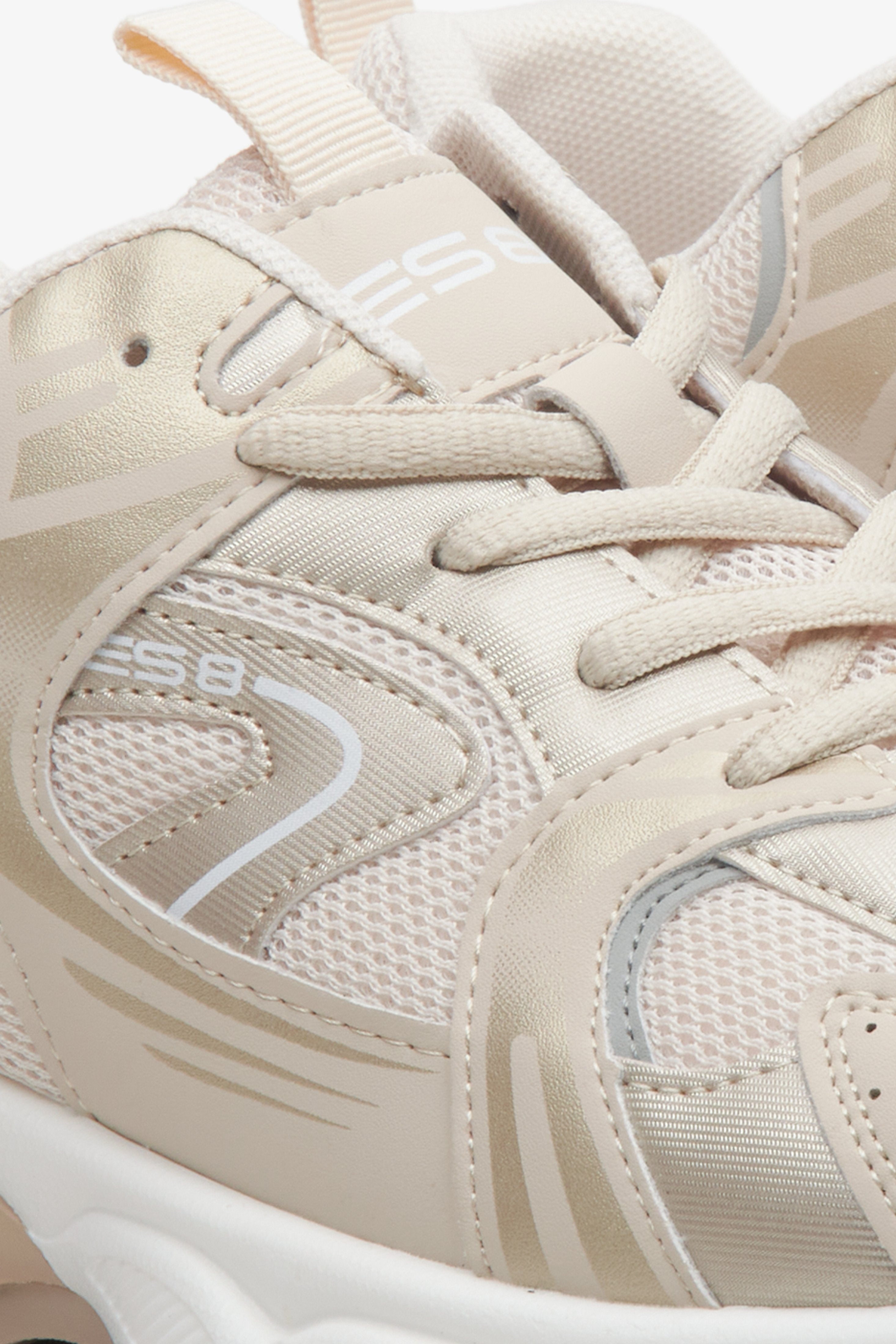 Women's beige and white  sneakers with golden details ES 8 - close-up on the seam line.