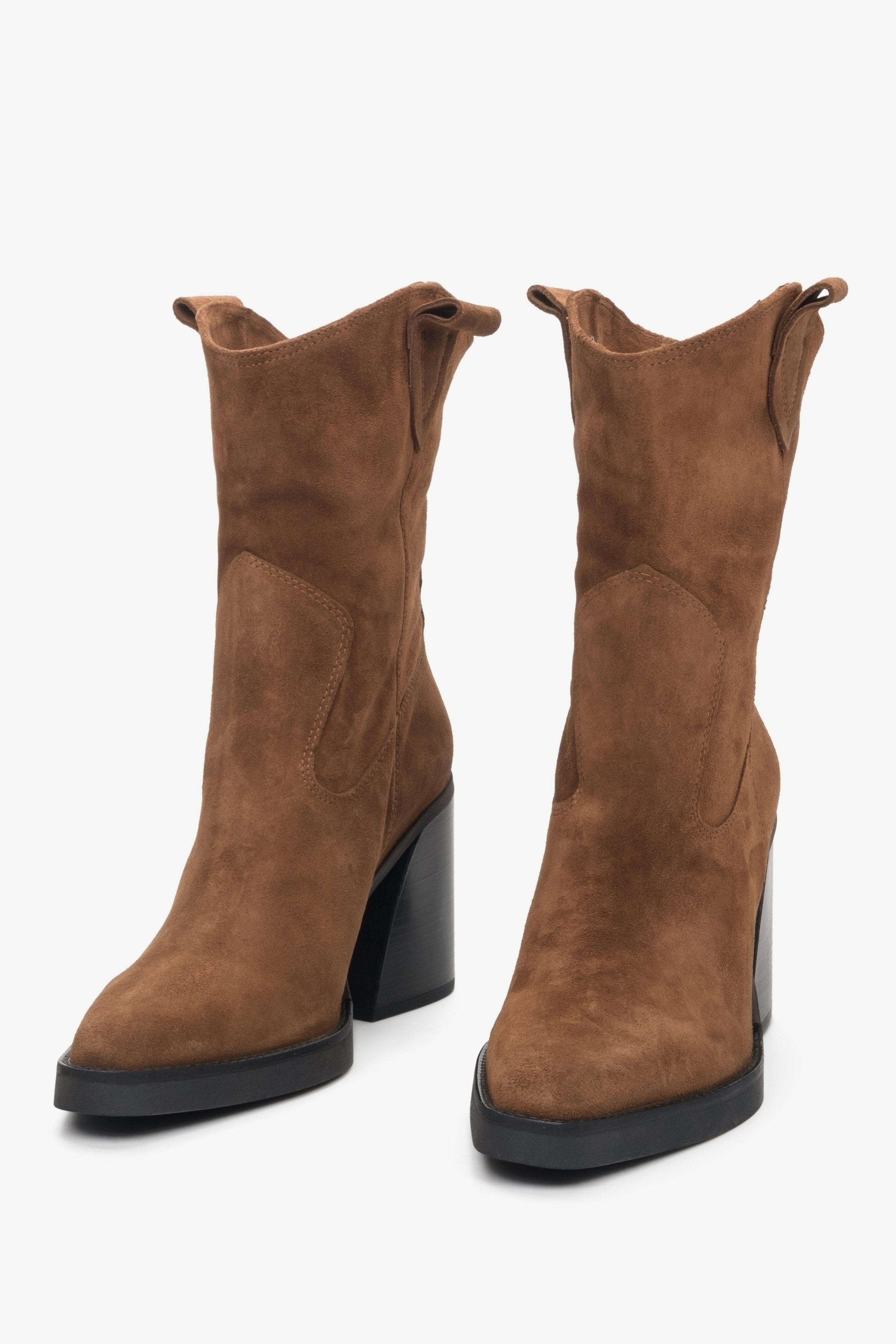 Women's brown suede cowboy boots with a pointed toe.