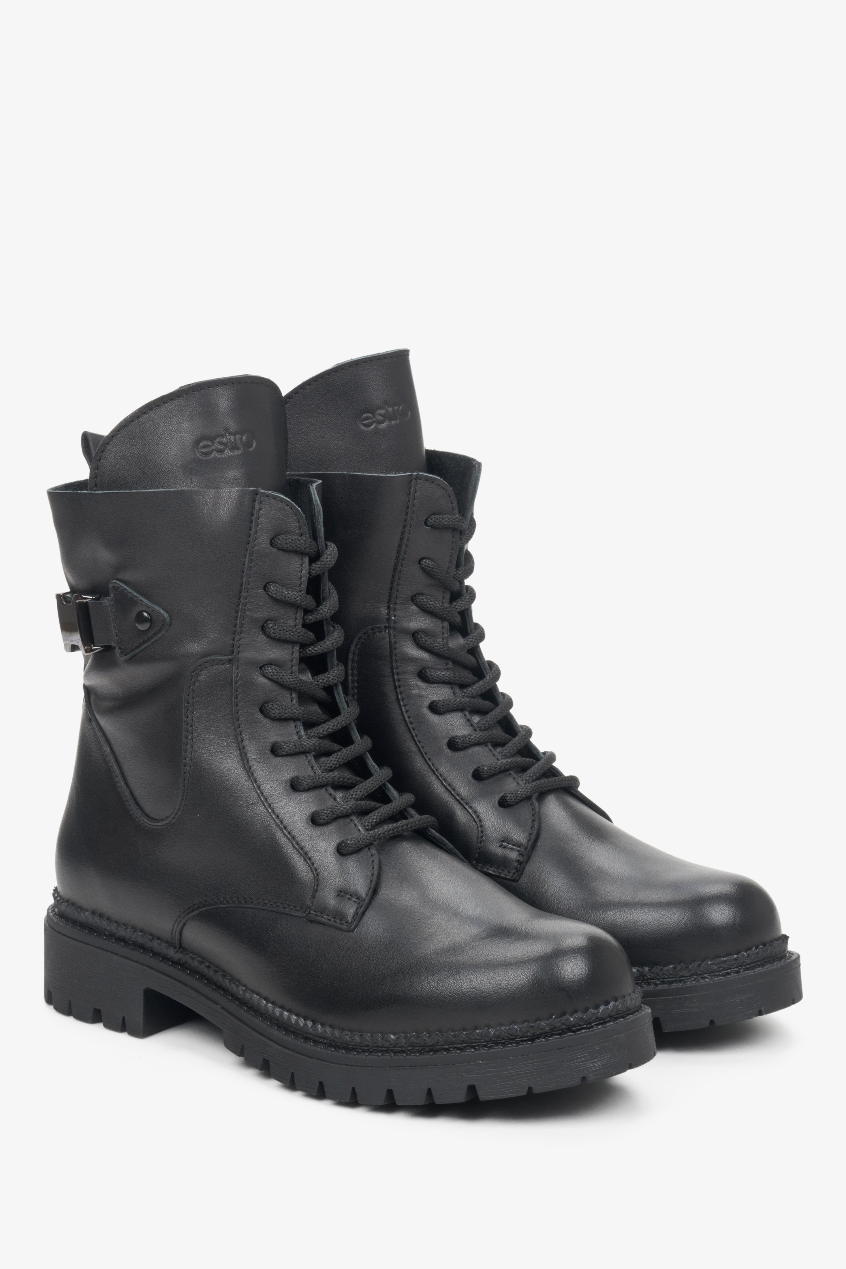 Women's black leather fall boots with laces and a decorative buckle.