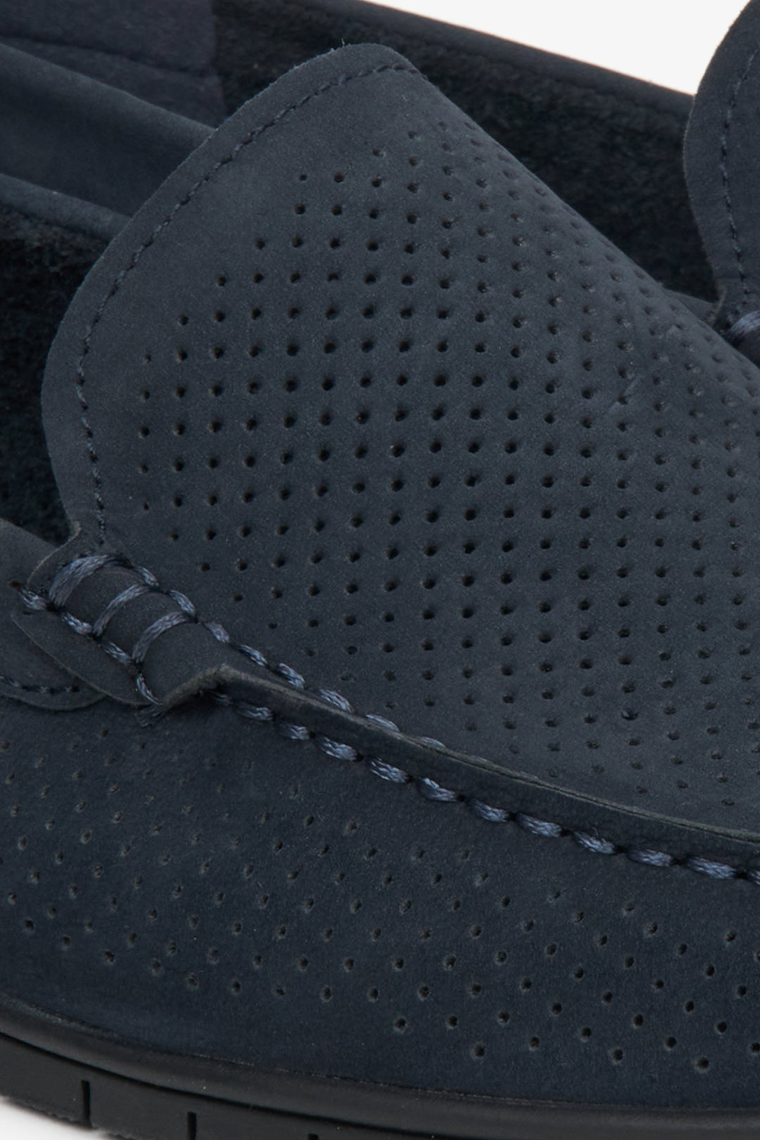 Estro brand navy blue loafers with perforation - close-up on the details.