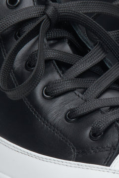 Women's black and white sneakers - close-up on details. 