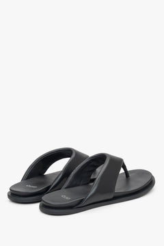 Estro women's black slide sandals - close-up on the heel strap and side profile of the shoe.