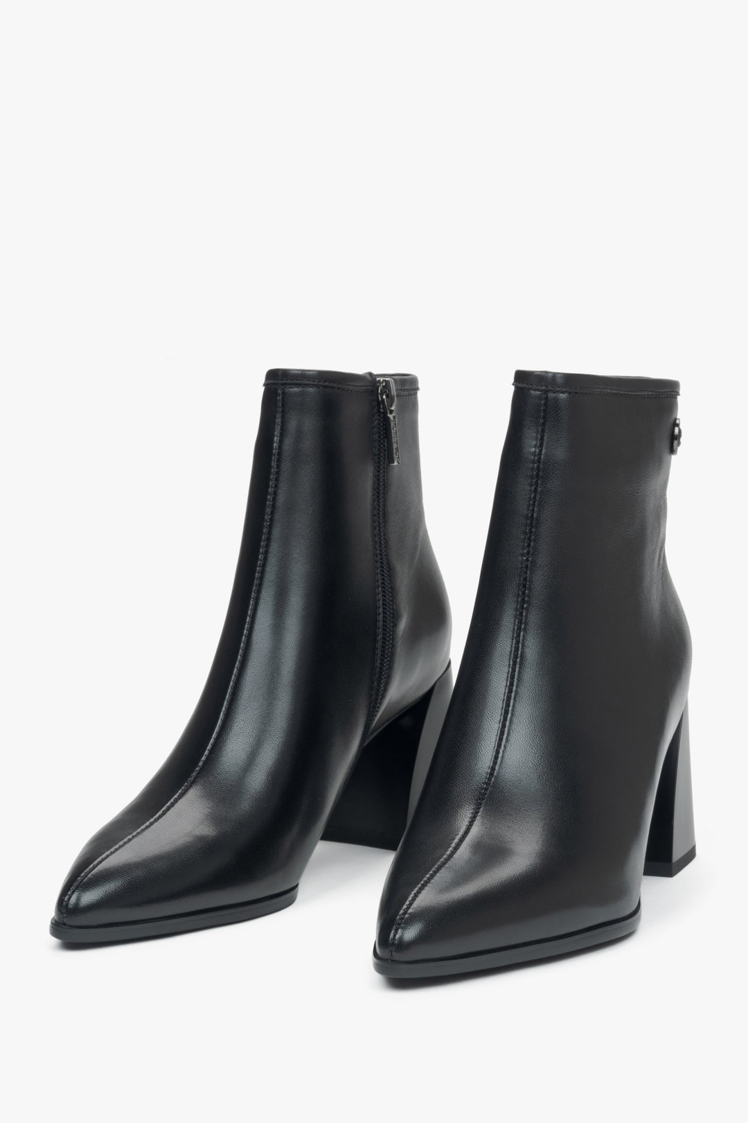 Black leather women's ankle boots with a pointed toe and heel by Estro - front view of the model.