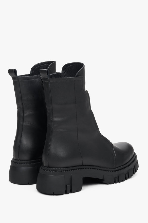 Elegant black women's natural leather ankle boots with an elastic insert for fall - presentation of a shoe toe and sideline.