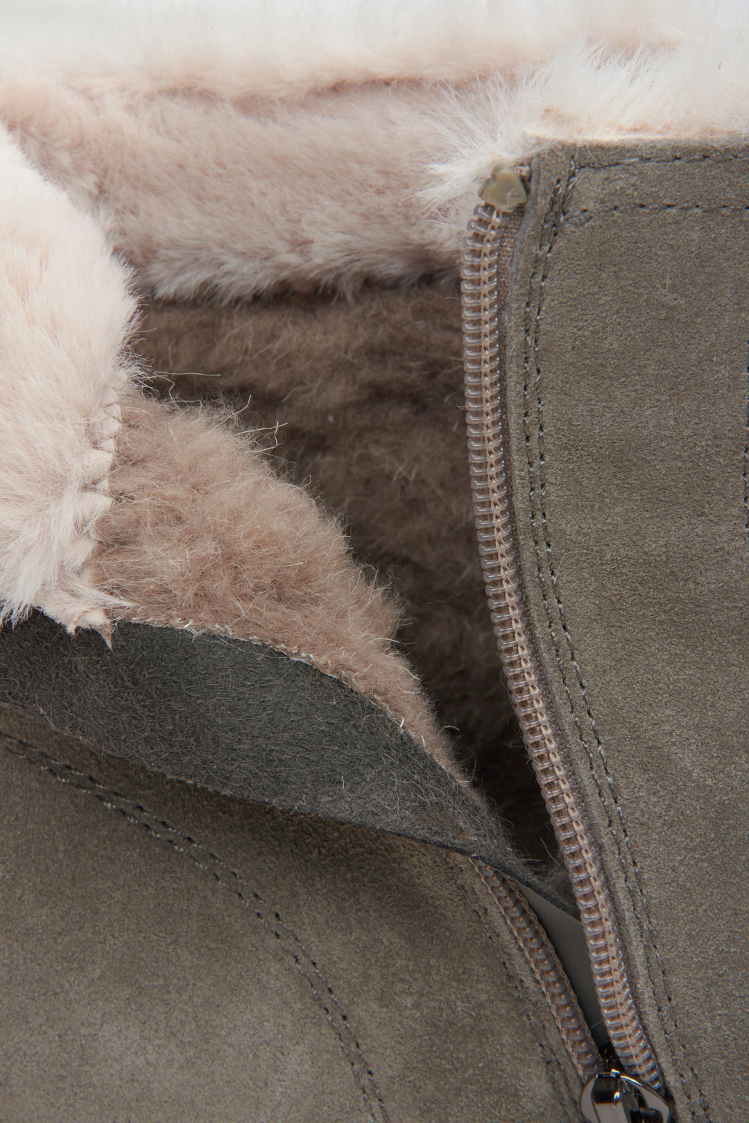 Winter women’s boots from Estro in a gray color, made of velour and natural fur – close-up of the model’s interior.