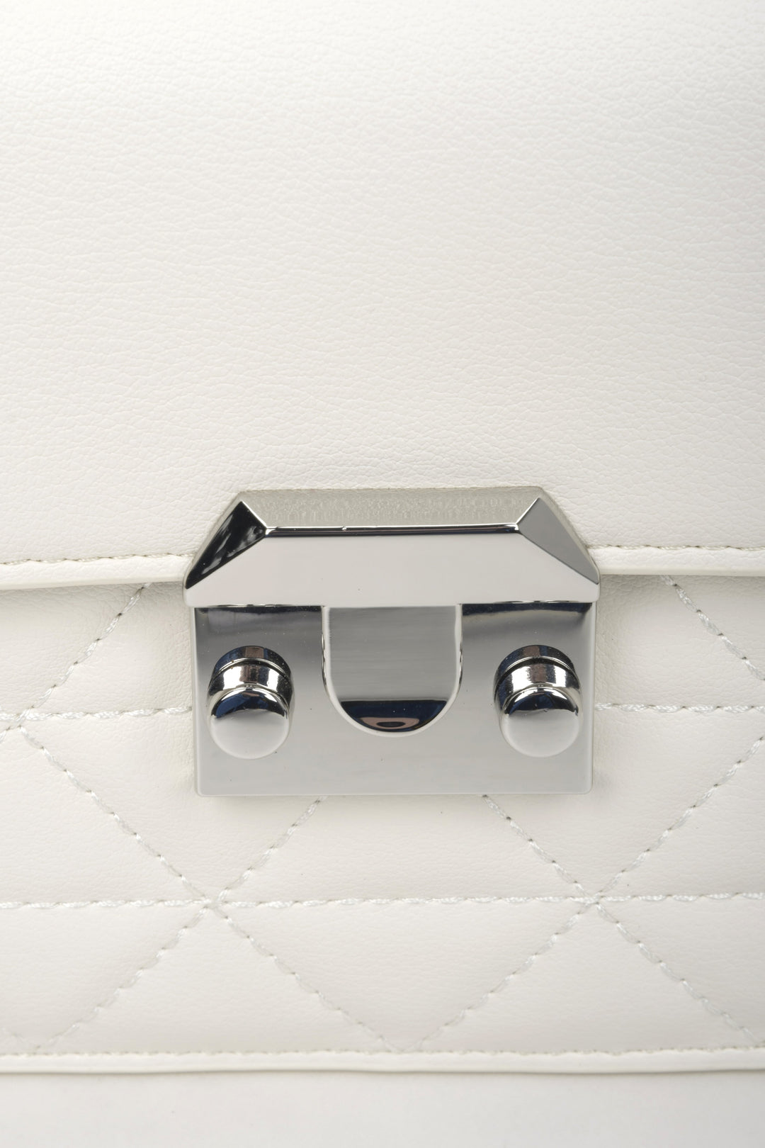 Women's white shoulder bag made of genuine leather - close-up on the details.
