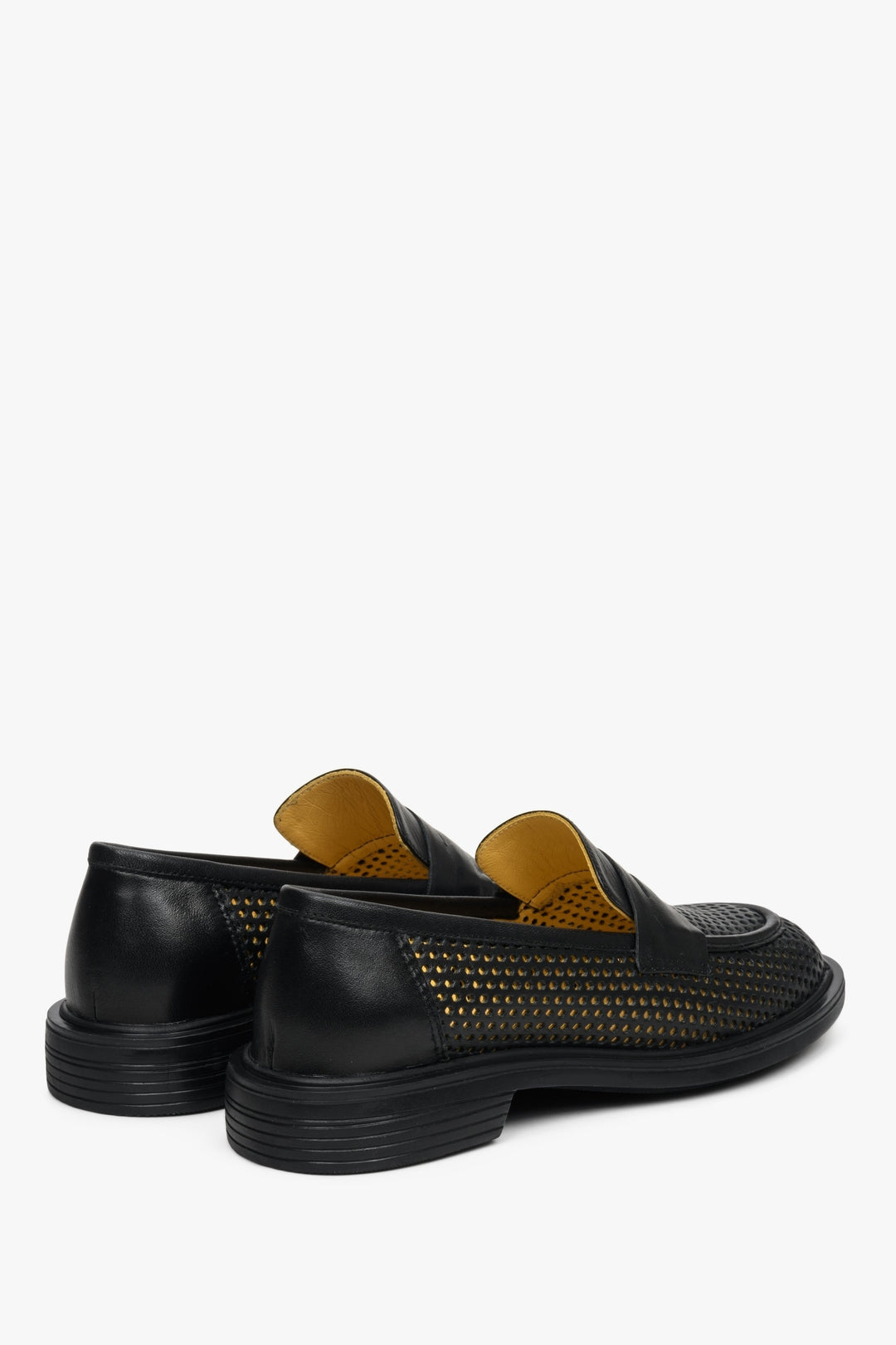 Comfortable black perforated women's loafers - close-up on the heel.