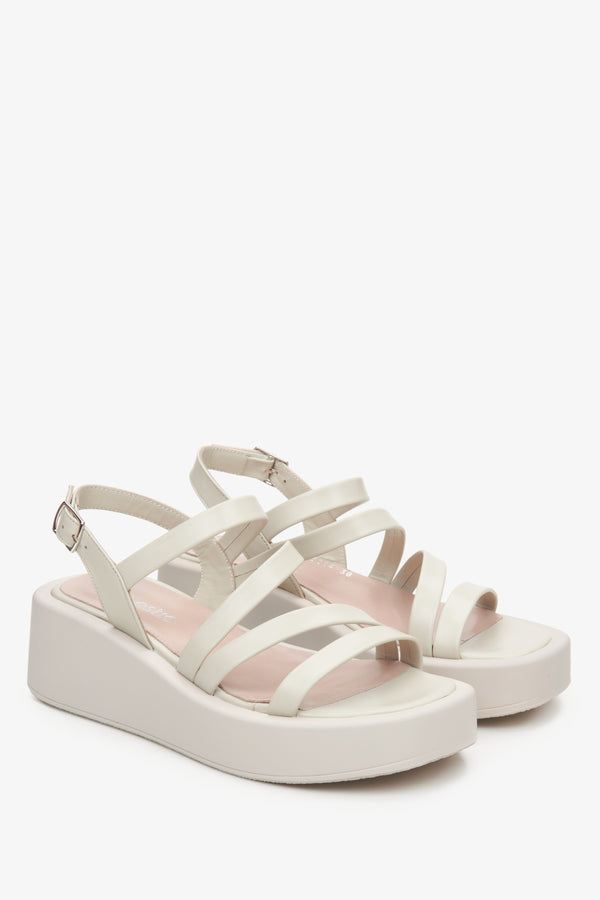 Women's leather wedge sandals by Estro in light beige colour.